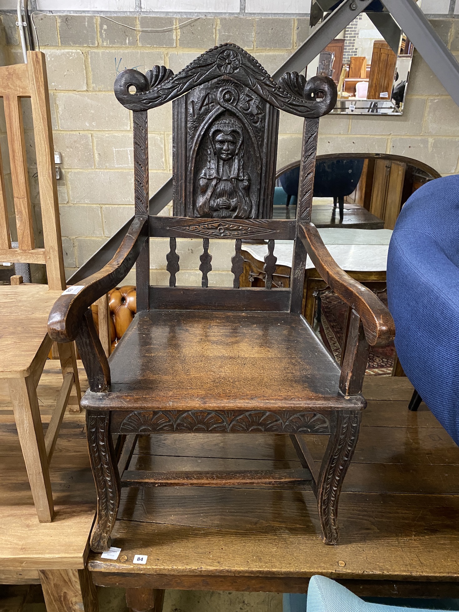 A 17th century style carved oak wainscot chair, width 63cm, depth 56cm, height 117cm